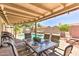 Outdoor dining area on the patio with a view of the pool at 8037 W Sweetwater Ave, Peoria, AZ 85381