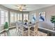 Cozy dining room with decorative rug, natural light, and modern decor at 8037 W Sweetwater Ave, Peoria, AZ 85381