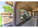 Home's charming front porch and yard with desert plants at 8037 W Sweetwater Ave, Peoria, AZ 85381