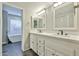 Beautiful bathroom featuring double sinks with modern fixtures and a separate tub area at 8151 E Del Joya Dr, Scottsdale, AZ 85258