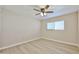 Cozy bedroom with hardwood floors, a ceiling fan, and natural light from window at 8151 E Del Joya Dr, Scottsdale, AZ 85258