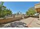 Backyard view of landscaped property with a fence, trees, and desert plants at 8151 E Del Joya Dr, Scottsdale, AZ 85258