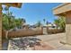 Backyard view of landscaped property with a fence, trees, and desert plants at 8151 E Del Joya Dr, Scottsdale, AZ 85258