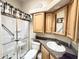 Clean bathroom features walk-in shower with grab bar and ample cabinet space at 944 S Nickel Dr, Apache Junction, AZ 85119