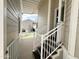 The stairway leading to the front door features white railings on the exterior at 944 S Nickel Dr, Apache Junction, AZ 85119