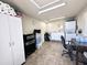 Organized garage is equipped with laundry area, storage cabinets, and workspace at 944 S Nickel Dr, Apache Junction, AZ 85119