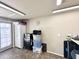 Bright garage area with storage cabinets and a door leading to the outside at 944 S Nickel Dr, Apache Junction, AZ 85119