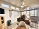 Well-lit living space with cozy armchairs, a ceiling fan, and clerestory windows at 944 S Nickel Dr, Apache Junction, AZ 85119