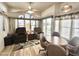 Comfortable living room featuring a ceiling fan, lots of windows, and plush seating area at 944 S Nickel Dr, Apache Junction, AZ 85119