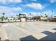 Community shuffleboard courts on a sunny day with shade trees at 944 S Nickel Dr, Apache Junction, AZ 85119