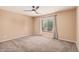 Relaxing bedroom with soft carpet, ceiling fan, and natural light at 11718 N 152Nd Dr, Surprise, AZ 85379