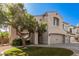 Charming front exterior with desert landscaping, well maintained lawn, and stucco accents at 11718 N 152Nd Dr, Surprise, AZ 85379