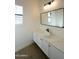 Modern bathroom boasts vessel sink, quartz countertop, and plantation shutters for natural light at 12856 E Rosewood Dr, Scottsdale, AZ 85255