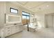 Lavish bathroom with soaking tub, dual vanities, illuminated mirrors, and a separate shower at 12856 E Rosewood Dr, Scottsdale, AZ 85255