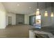 Open concept living area shows modern fireplace, recessed lighting, and views to the outside at 12856 E Rosewood Dr, Scottsdale, AZ 85255