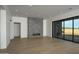 Spacious living room shows modern fireplace, recessed lighting, and sliding glass doors to the backyard at 12856 E Rosewood Dr, Scottsdale, AZ 85255