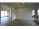 Clean, bright living room shows large windows and hardwood floors at 12856 E Rosewood Dr, Scottsdale, AZ 85255