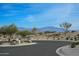 Scenic street view with desert landscaping and mountain backdrop at 12856 E Rosewood Dr, Scottsdale, AZ 85255
