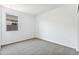 The vacant bedroom is bright and spacious, featuring carpet and a window for natural light at 1317 S Vista Ave, Florence, AZ 85132