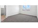 Bedroom featuring neutral carpet, and a closet with shelving at 1317 S Vista Ave, Florence, AZ 85132