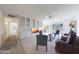 Cozy living room with built in bookshelves, a ceiling fan, and neutral colors at 13443 W Gable Hill Dr, Sun City West, AZ 85375