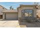 Charming single-story home with well-manicured front yard and a two-car garage at 1425 S Lindsay Rd # 18, Mesa, AZ 85204