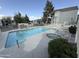 Inviting community pool with clear blue water, spa, comfortable lounge chairs and well-manicured landscaping at 1505 N Center St # 132, Mesa, AZ 85201