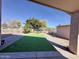 View of the backyard with artificial turf and brick pavers at 1624 W Minton St, Phoenix, AZ 85041