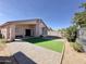 Fully fenced backyard with patio, turf, and brick pavers at 1624 W Minton St, Phoenix, AZ 85041