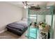 This bedroom has a bed, ceiling fan, and ladder to top bunk at 1624 W Minton St, Phoenix, AZ 85041