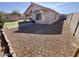 Home exterior featuring a patio, turf, shed, and gravel landscaping at 1624 W Minton St, Phoenix, AZ 85041
