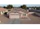 Well-maintained single-story home featuring a two-car garage and neutral-toned exterior at 1624 W Minton St, Phoenix, AZ 85041