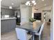 Updated eat-in kitchen features gray cabinetry, stainless appliances, and a pantry at 1624 W Minton St, Phoenix, AZ 85041