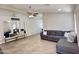 Open-concept living area with tile floors, neutral walls, and stylish decor at 1624 W Minton St, Phoenix, AZ 85041