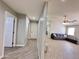 Open living room and hallway with tile floors and neutral paint scheme at 1624 W Minton St, Phoenix, AZ 85041