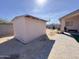 View of a stucco shed with a privacy fence and exterior equipment at 1624 W Minton St, Phoenix, AZ 85041