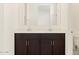 Modern bathroom featuring a double sink vanity with stylish dark wood cabinetry at 17426 W Eva St, Waddell, AZ 85355