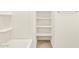 A clean bathroom featuring shower and shelving perfect for organization at 17426 W Eva St, Waddell, AZ 85355
