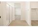 Elegant bathroom featuring a glass-enclosed shower and access to a walk-in closet at 17426 W Eva St, Waddell, AZ 85355