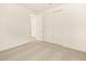 Bright bedroom featuring plush carpet flooring and ample closet space at 17426 W Eva St, Waddell, AZ 85355