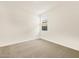 A bright bedroom with neutral carpet, perfect for a cozy retreat at 17426 W Eva St, Waddell, AZ 85355