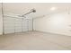 Spacious garage with a modern overhead door and ample storage space at 17426 W Eva St, Waddell, AZ 85355