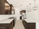 Modern kitchen featuring stainless steel appliances, granite countertops, and ample cabinet space at 17426 W Eva St, Waddell, AZ 85355