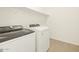 Convenient laundry room with modern, efficient washer and dryer units at 17426 W Eva St, Waddell, AZ 85355