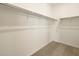 Spacious walk-in closet with ample shelving, perfect for organized storage solutions at 17426 W Eva St, Waddell, AZ 85355