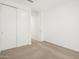 Bedroom with carpet and closet, offering a peaceful retreat at 17434 W Eva St, Waddell, AZ 85355