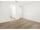 Bright bedroom with carpet and ensuite bathroom, offering a peaceful retreat at 17434 W Eva St, Waddell, AZ 85355