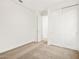 Bright bedroom with neutral carpet, white walls and closet with sliding doors at 17434 W Eva St, Waddell, AZ 85355