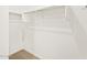 Walk-in closet with ample shelving and hanging space, providing organized storage solutions at 17434 W Eva St, Waddell, AZ 85355