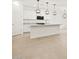 Modern kitchen with stainless steel appliances, granite countertops and bright lighting at 17434 W Eva St, Waddell, AZ 85355